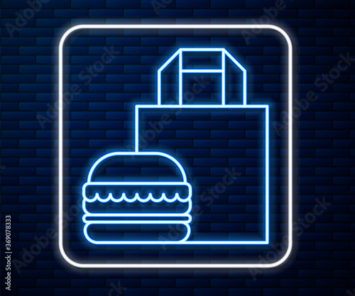 Glowing neon line Online ordering and burger delivery icon isolated on brick wall background. Vector Illustration.