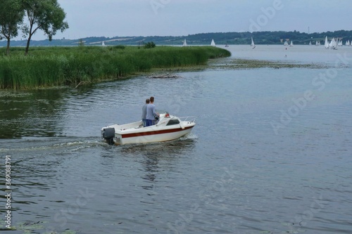 A motor boat swiming out onto Vistula river in Poland 