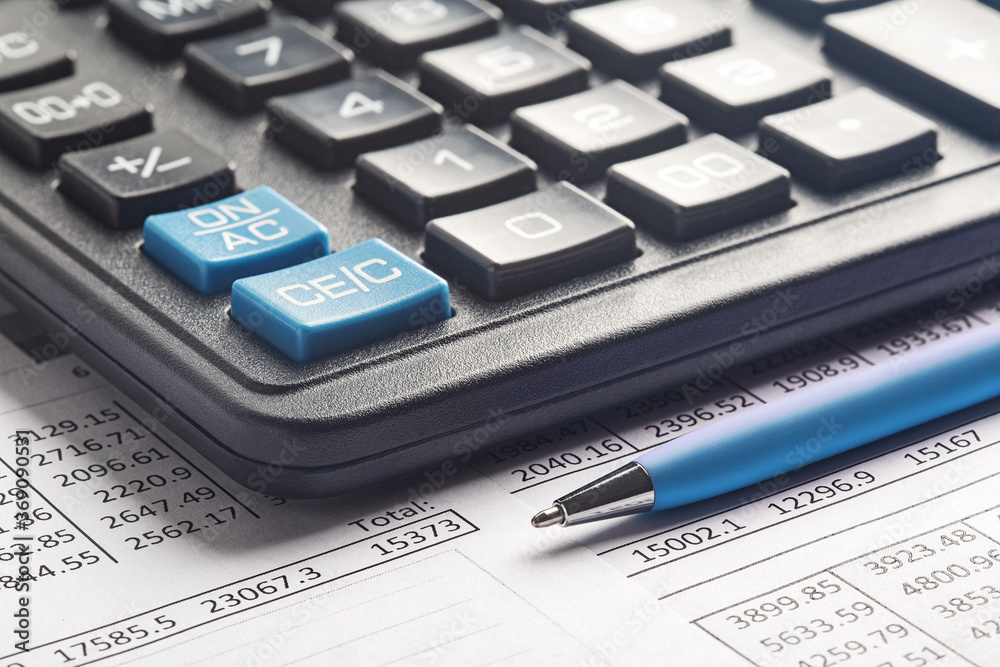 accounting document with pen and calculator. Concept of banking, financial report and financial audit. accounting document with pen and calculator. Concept of banking, financial report and financial audit.