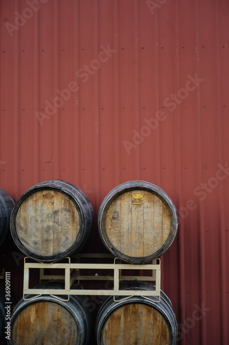 Wood barrels near red wall photo