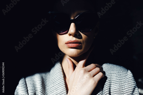 Closeup portrait of model in sunglasses. photo