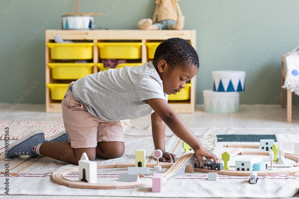A Boy Playing with Railway Toy A Boy Playing with Railway Toy