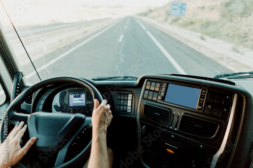 Scene of a truck driver driving on the road. photo