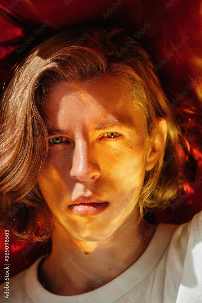 Handsome sensual man with surreal red flare on face Stock Photo | Adobe ...
