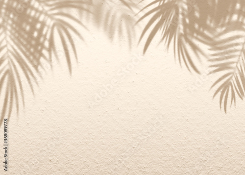 Fototapeta Naklejka Na Ścianę i Meble -  Brown cream clay mud grunge cement texture wall leaf plant shadow background.Summer tropical travel beach with minimal concept. Flat lay palm nature.