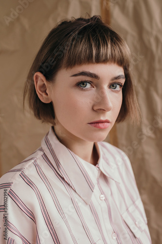 Portrait of modern woman over craft paper