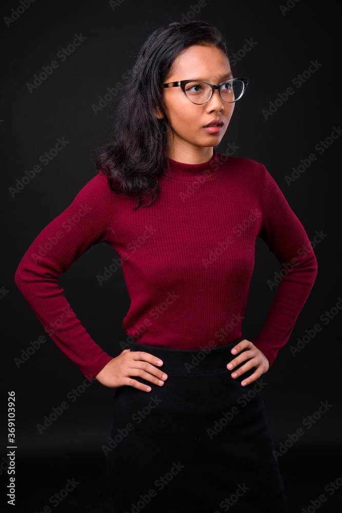 Portrait of young beautiful Asian businesswoman with eyeglasses Portrait of young beautiful Asian businesswoman with eyeglasses