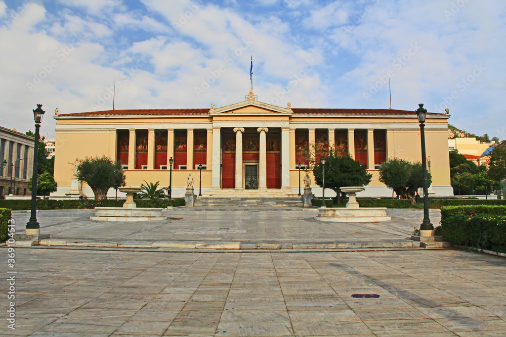 Front street view across the square of the National and Kapodistrian University of Athens, Greece.  Usually referred to as the University of Athens which is a public university.