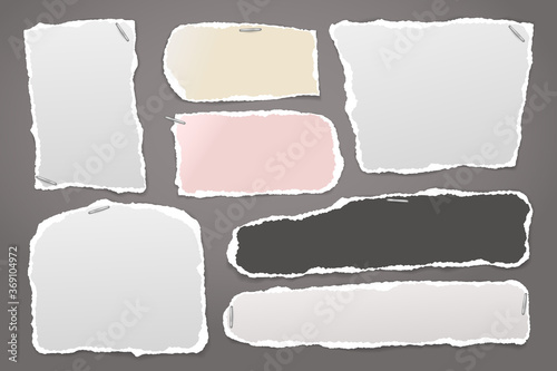 Torn of white and colorful note, notebook paper strips and pieces stuck with swingline on dark grey background. Vector illustration