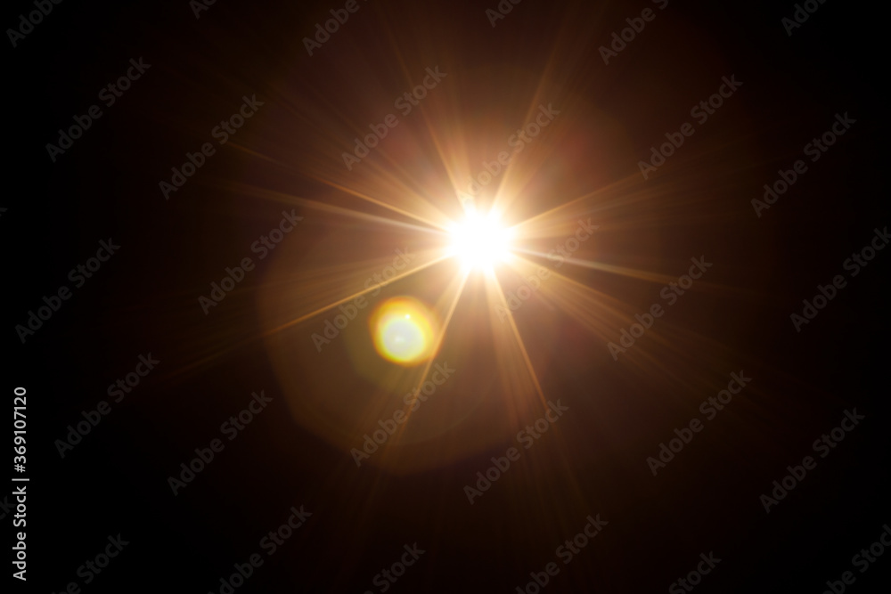 Easy to add lens flare effects for overlay designs or screen blending mode to make high-quality images. Abstract sun burst, digital flare, iridescent glare over black background.