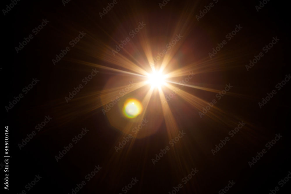 Easy to add lens flare effects for overlay designs or screen blending mode to make high-quality images. Abstract sun burst, digital flare, iridescent glare over black background.