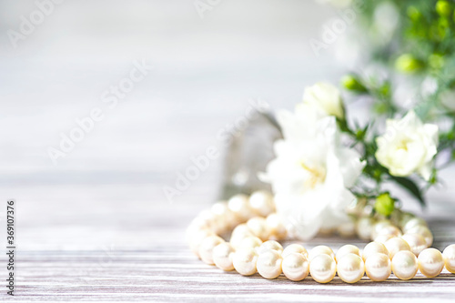 Beautiful white pearl necklace with white flowers.