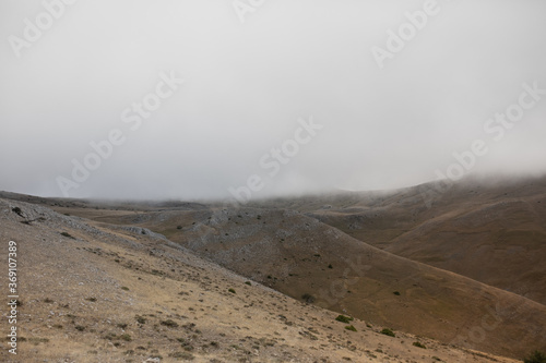 High plains with clouds flying over them. photo