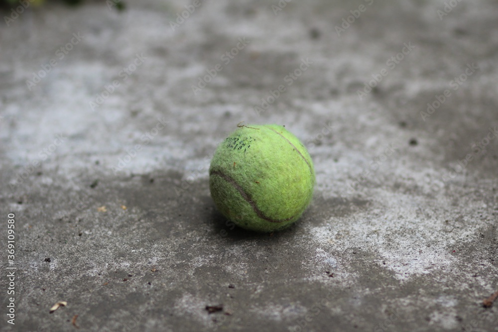 Tenniss ball on the floor