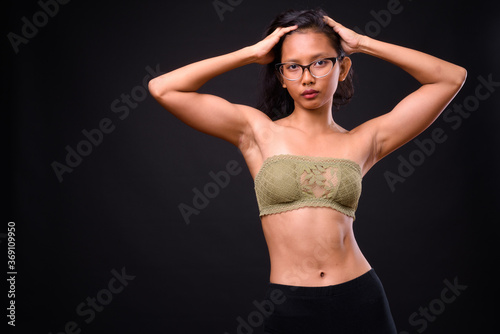 Portrait of young beautiful Asian woman in underwear