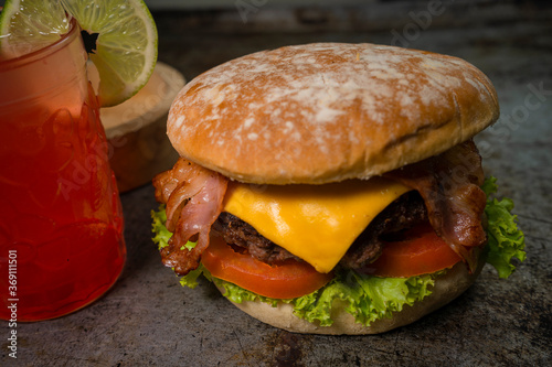 Burger ingredients isolated on rustic background.