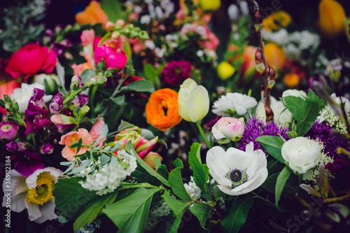 Closeup view of vibrant multicolored flower blooms in farmers market bouquets 