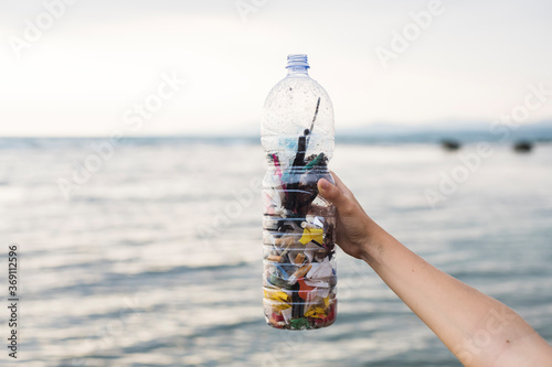Volunteers cleaning up the beach from plastic and waste