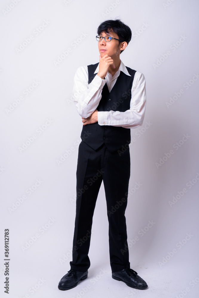Portrait of young handsome Asian businessman with eyeglasses Portrait of young handsome Asian businessman with eyeglasses