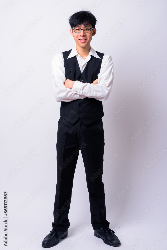 Portrait of happy young handsome Asian businessman Portrait of happy young handsome Asian businessman