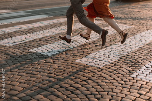 Couple in love crosses the road