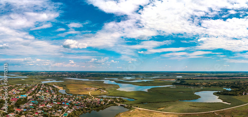 the confluence of the Levy Beysuzhek and the Beysug rivers between the villages of Bryukhovetskaya and Pereyaslavskaya (Krasnodar Territory. South of Russia) - an aerial panorama of islands and lakes  photo