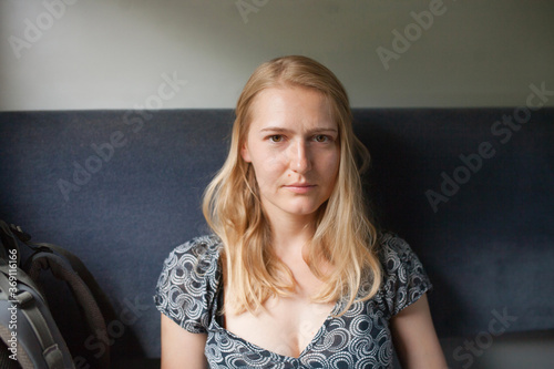 portrait of a blonde girl in a train car photo
