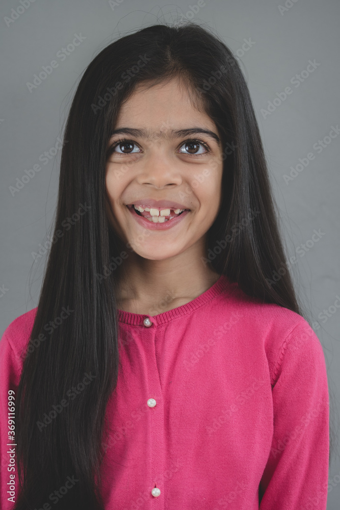 Fototapeta premium School age girl of British Indian descent displays different facial expressions.