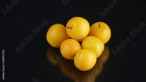 Wallpaper Mural yellow cherry plums on the black background Torontodigital.ca