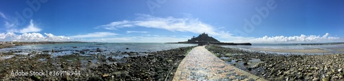 St Michael s Mount is a tidal island in Mount s Bay  Cornwall. The island is linked to the town of Marazion by a man-made causeway passable between mid-tide and low water. 