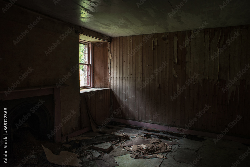 Light through window of abandoned house Light through window of abandoned house