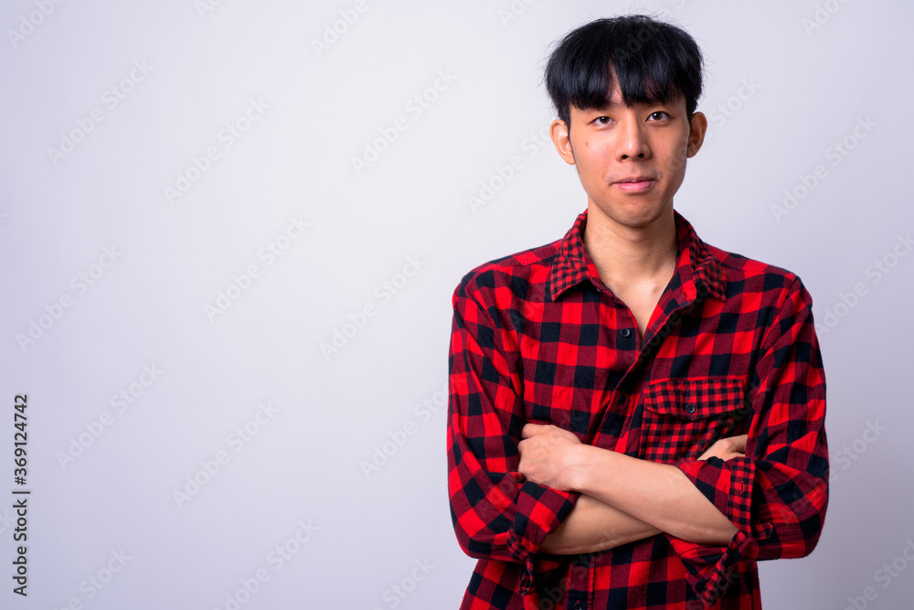 Portrait of young handsome Asian hipster man Portrait of young handsome Asian hipster man