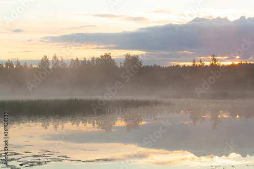 River in morning covered with fog