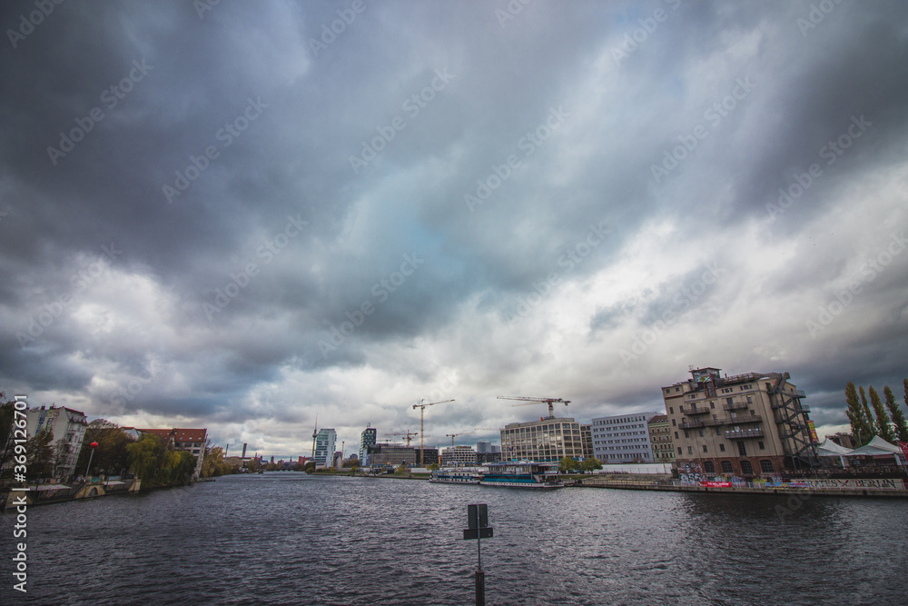 View of the Spree river on a cloudy day in Berlin, Germany.