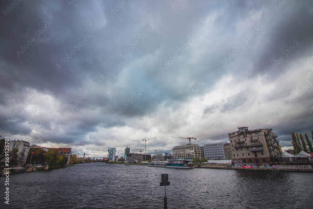 View of the Spree river on a cloudy day in Berlin, Germany. View of the Spree river on a cloudy day in Berlin, Germany.