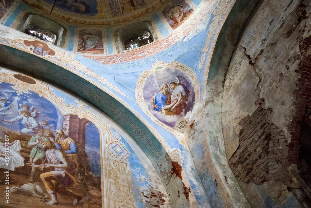 Remains of frescoes on the wall of an abandoned church.