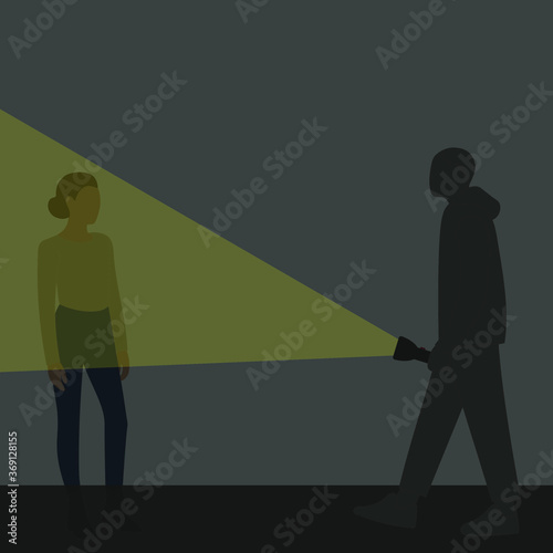 Male character directs luminous flashlight to female character in the dark