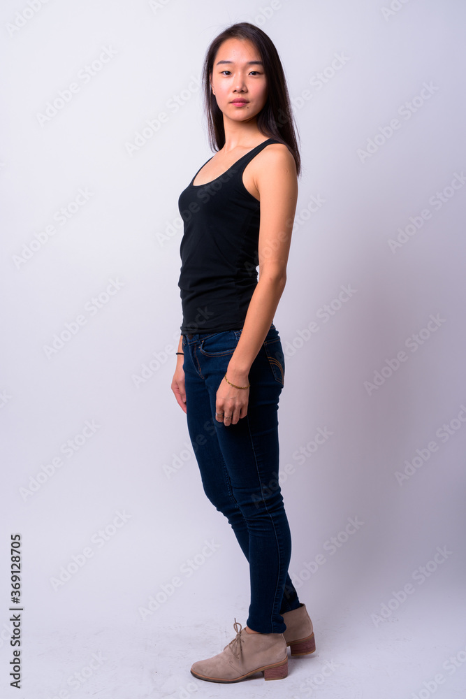 Full body shot of young beautiful Asian woman Full body shot of young beautiful Asian woman