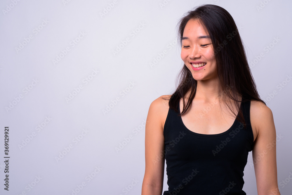 Portrait of happy young beautiful Asian woman Portrait of happy young beautiful Asian woman