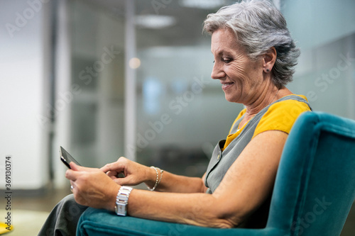 Side view of senior woman using a digital laptop photo