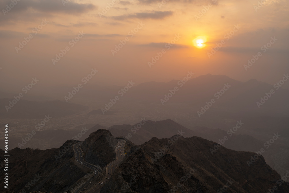 Traffic travelling around mountain pass on the zig zag road in Al Hada, Taif region of Saudi Arabia Traffic travelling around mountain pass on the zig zag road in Al Hada, Taif region of Saudi Arabia