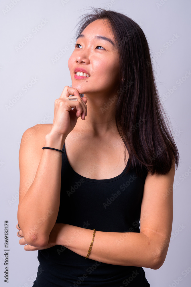 Portrait of happy young beautiful Asian woman Portrait of happy young beautiful Asian woman