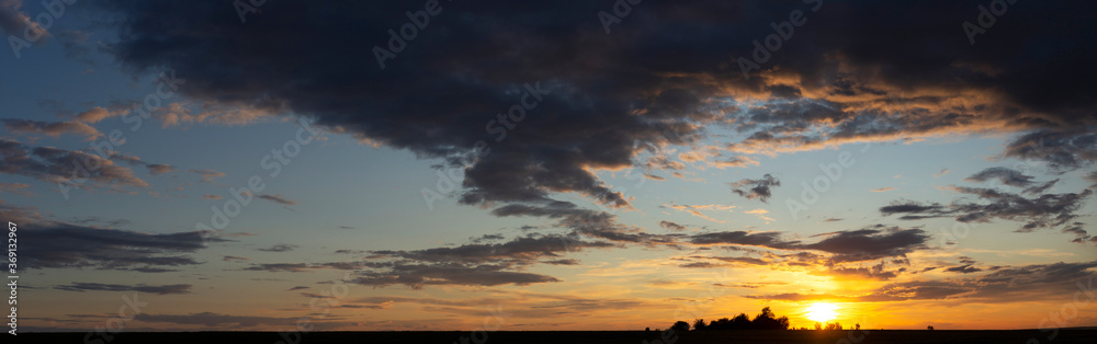 Obraz premium Panorama. Landscape with bloody sunset. Fantastic skies on the planet earth. Purple clouds. Tragic gloomy sky. Twilight.