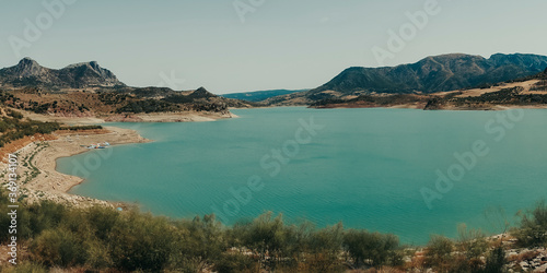 Panoramic of blue lake with nature and mountains.