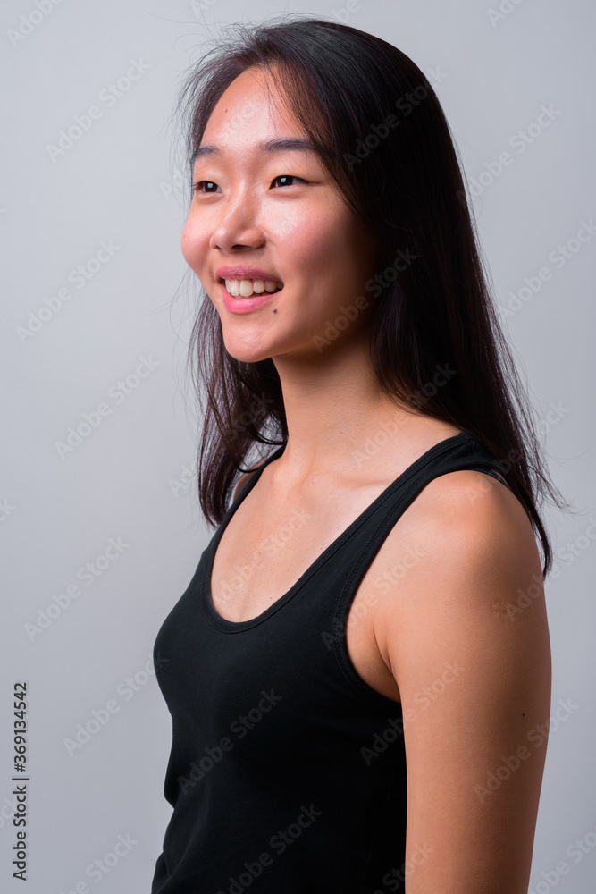 Portrait of happy young beautiful Asian woman Portrait of happy young beautiful Asian woman