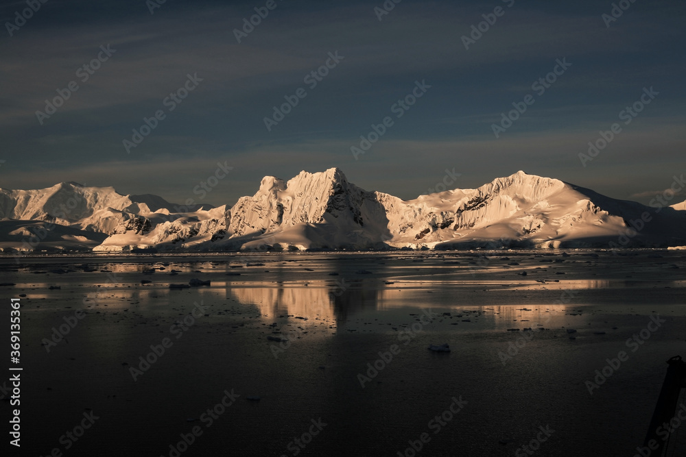 Sunset at Paradise Bay icebergs, Antarctic Peninsula.
