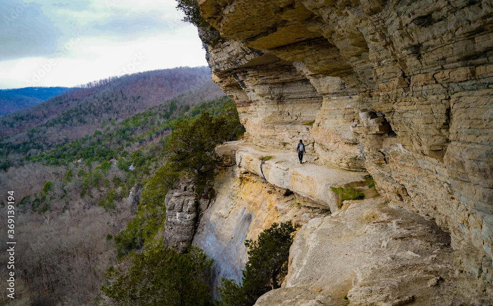 Female hiker on cliff hiking trail in Arkansas