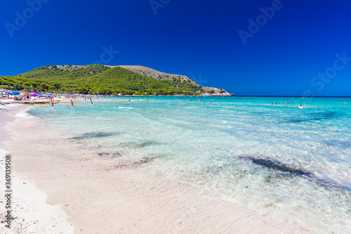 CALA AGULLA  MALLORCA  SPAIN - 21 July 2020  People enjoying summer on the popular beach on Mallorca   Balearic Islands.