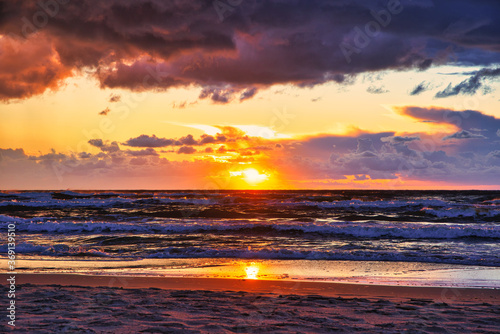 Sunset view over the sea. Beautiful sunset over the sea. View of the beach, sea and sunset.