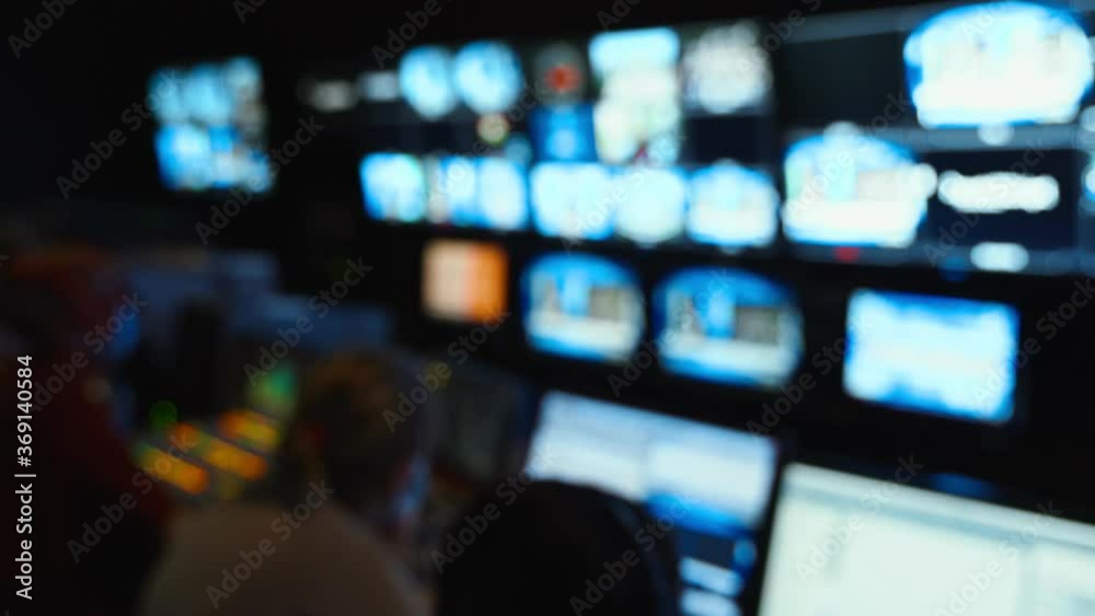 Professional sound engineer's console. Television Broadcast, working with video and audio mixer, control broadcast in recording studio. blurred background, monitors.